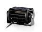 Angled view of the rear side of the lamp showing heat sink fins, mounting points, and wiring ports.