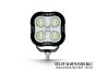 Front view of the lamp face showing the lens and central light source, with the housing and bezel clearly visible.